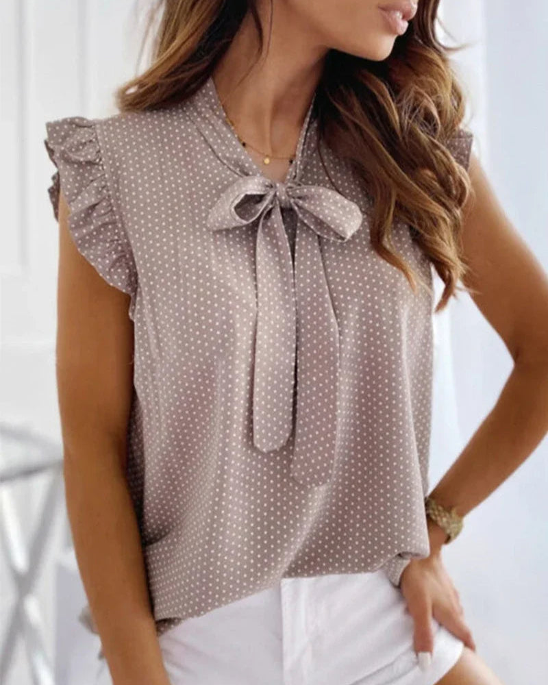 Blusa sin mangas con volantes y detalle de lazo