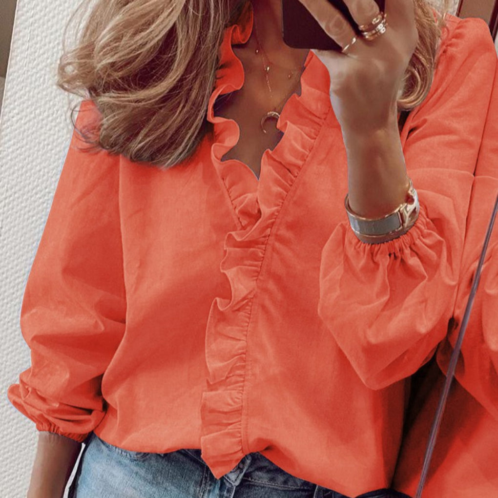 Blusa con volantes en color verde azulado y mangas abullonadas