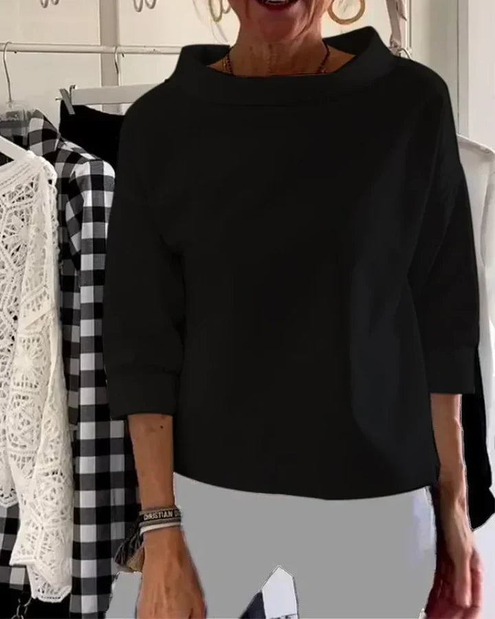 Top informal con solapas anchas y cuello de tortuga a media altura para un look elegante