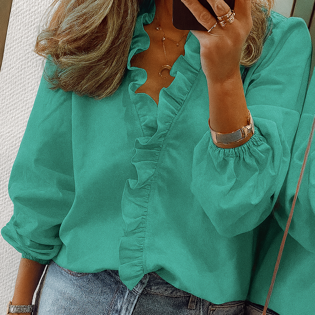 Blusa con volantes en color verde azulado y mangas abullonadas