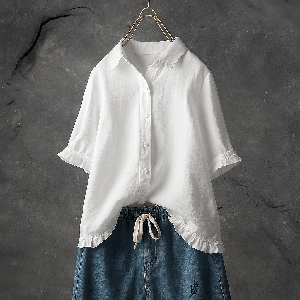 Blusa de algodón abotonada con bajo con volantes