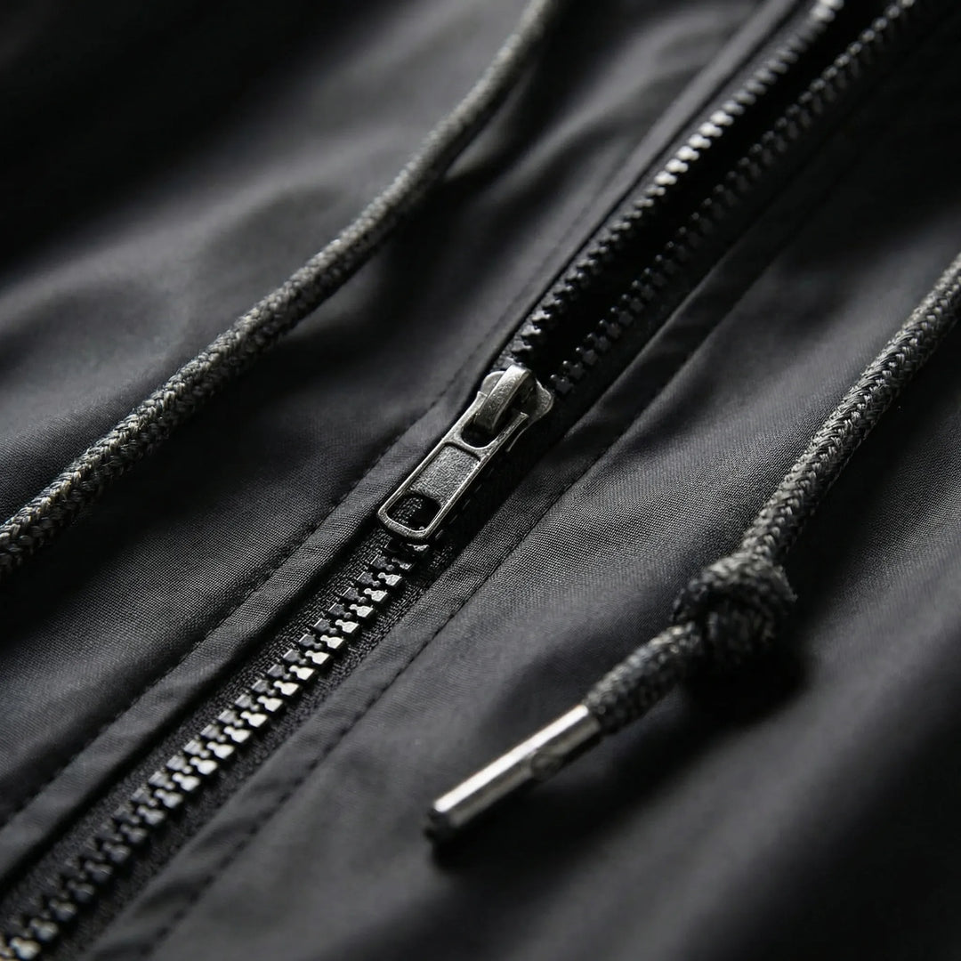 Drizzlara - Chaqueta de exterior con capucha repelente al agua