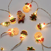 Luces de cadena de figuras navideñas a pilas
