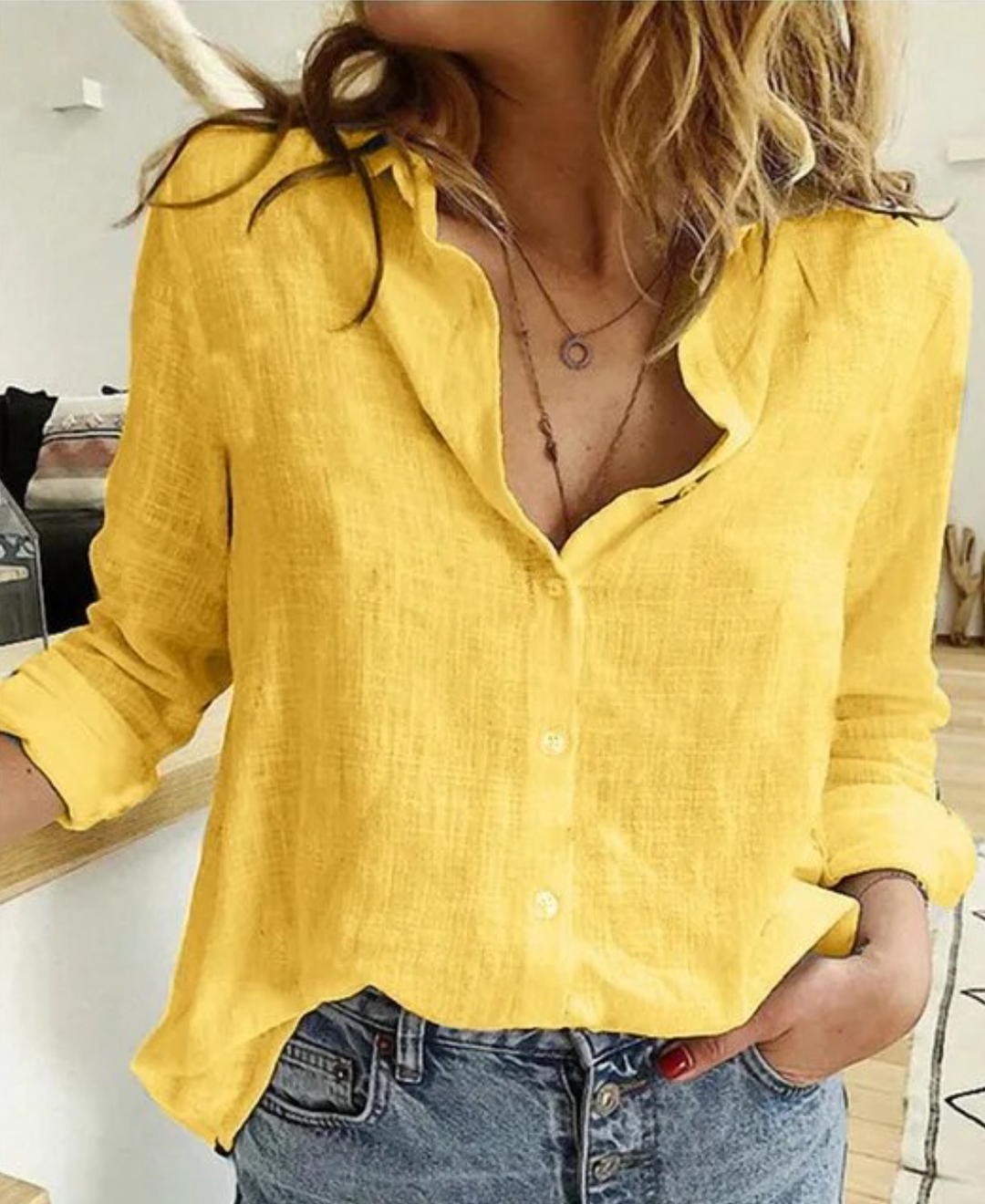 Blusa de manga larga con elegante drapeado y tejido suave