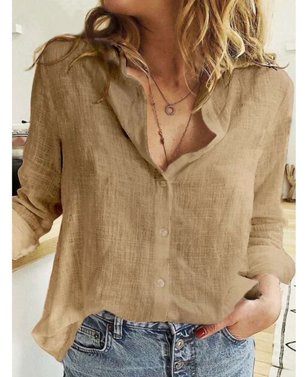 Blusa de manga larga con elegante drapeado y tejido suave